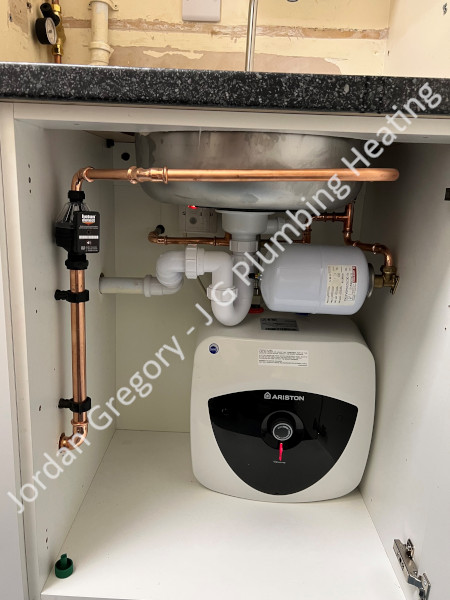 hotun, hotun shield and hotun detect installed alongside an undercounter small unvented water heater