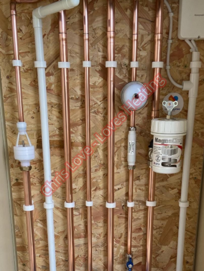 A picture of a typical boiler installation using a hotun dry trap tundish and a hotun detect alarm unit
