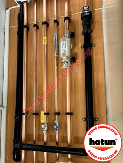 A picture of a typical boiler installation using a hotun dry trap tundish and a hotun detect alarm unit