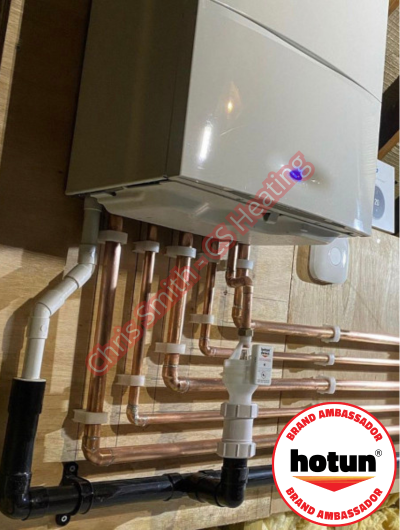 A picture of a typical boiler installation using a hotun dry trap tundish and a hotun detect alarm unit