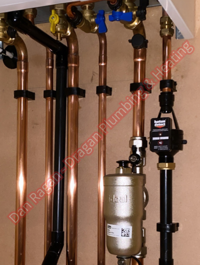 A picture of a typical boiler installation using a hotun dry trap tundish and a hotun detect alarm unit