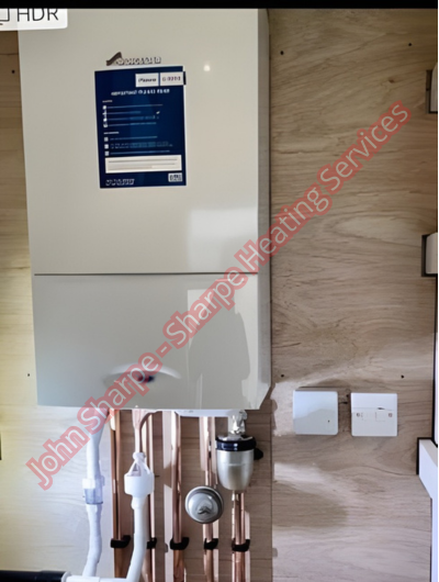 A picture of a typical boiler installation using a hotun dry trap tundish and a hotun detect alarm unit