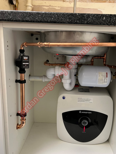 A picture of a typical boiler installation using a hotun dry trap tundish and a hotun detect alarm unit