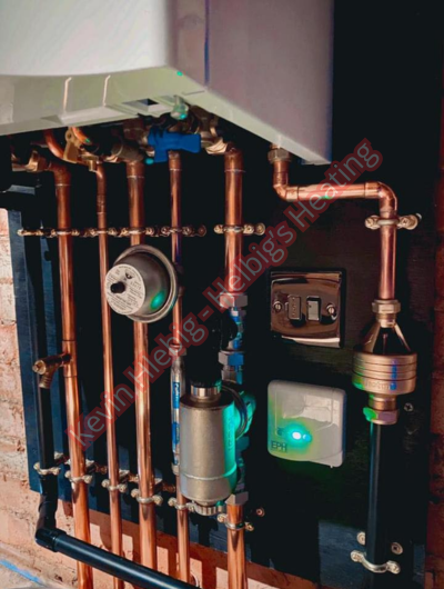 A picture of a typical boiler installation using a hotun dry trap tundish and a hotun detect alarm unit