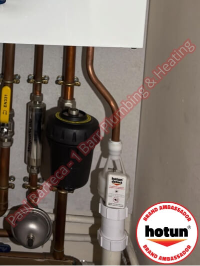 A picture of a typical boiler installation using a hotun dry trap tundish and a hotun detect alarm unit
