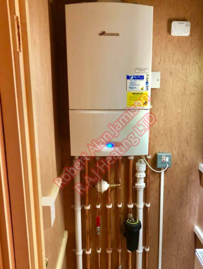 A picture of a typical boiler installation using a hotun dry trap tundish and a hotun detect alarm unit