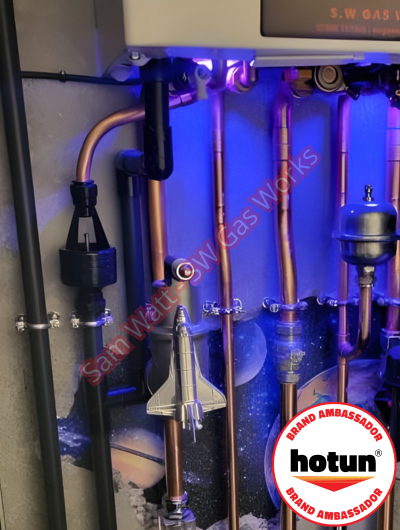 A picture of a typical boiler installation using a hotun dry trap tundish and a hotun detect alarm unit