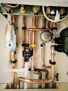 A picture of a typical boiler installation using a hotun dry trap tundish and a hotun detect alarm unit